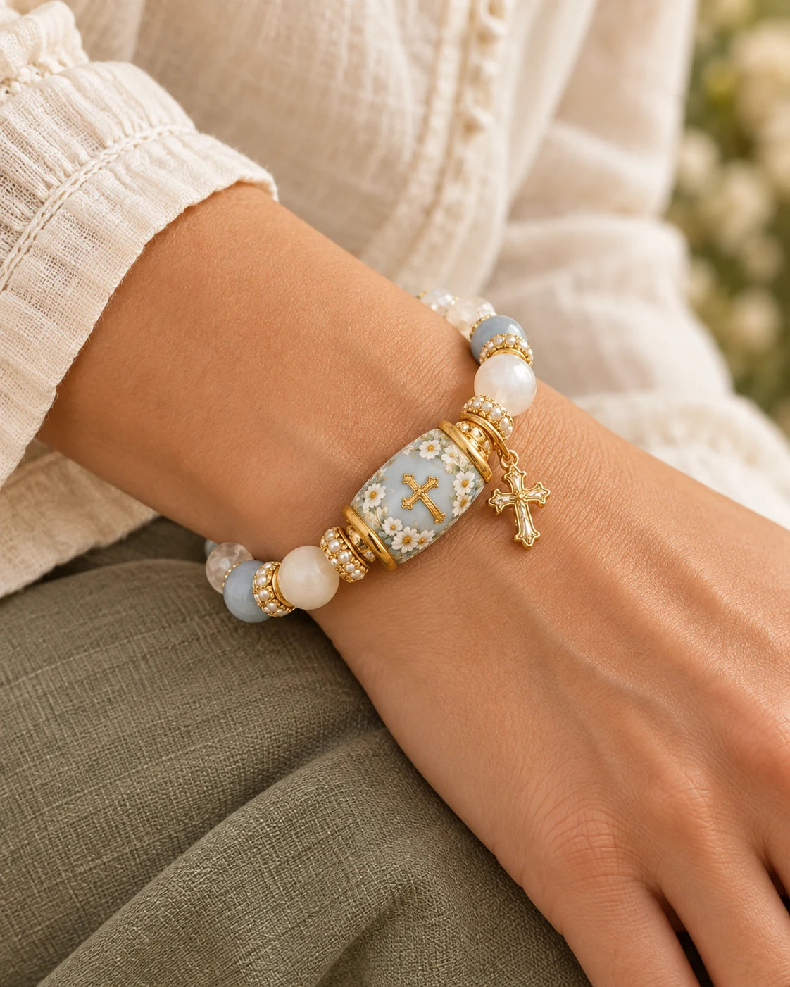 A hand gently exploring the Grace in Bloom bracelet